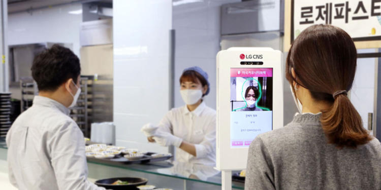 An employee using LG CNS's "face recognition community currency" system.