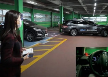 An 5G-powered autonomous vehicle parks in a public parking lot in western Seoul on its own during a demonstration by LG Uplus